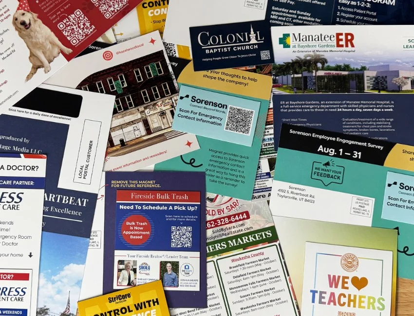 A spread of custom magnet mailer postcards printed for real clients